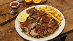 Leitão assado no forno com laranja e alho: pele estaladiça e carne suculenta